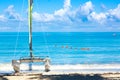 Tropical beach with a colorful sailboat on a summer day with turquoise water and blue sky. Varadero resort, Cuba. Vacation