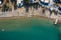 Tropical beach with colorful umbrellas - Top down aerial view. Lindos , Rhodes, Greece.