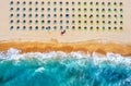 Tropical beach with colorful umbrellas.