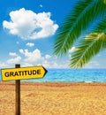 Tropical beach and direction board saying GRATITUDE Royalty Free Stock Photo