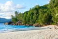 Tropical beach with granite boulders and palm trees. Mahe, Seychelles Royalty Free Stock Photo