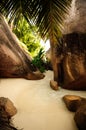 Tropical beach with granitic rocks and blue water