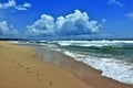 Tropical beach. Indian Ocean coast. Turquoise waves roll ashore Royalty Free Stock Photo