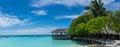 Tropical beach island panorama with hut at Maldives Royalty Free Stock Photo