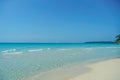 Tropical beach at Koh Kood, Thailand. turquoise sea water, ocean wave, yellow sand, green palms, sun blue sky, white clouds, Royalty Free Stock Photo