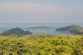 Tropical beach landscape panorama. Beautiful turquoise ocean waives with boats and sandy coastline from high view point. Kata and Royalty Free Stock Photo