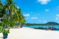 Tropical beach landscape. Perfect white sand, green palm trees and blue water. Travel and relaxation in the tropics