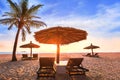 Tropical beach landscape at sunset, summer vacation holiday in paradise luxurious coastal hotel resort, palm tree, sun bed