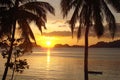 Tropical beach with palm trees at sunset, El Nido, Palawan island in the Philippines Royalty Free Stock Photo