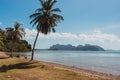 Tropical beach with palms and isles on background. Beautiful lagoon in Philippines. Summer vacation. Asian travel. Royalty Free Stock Photo