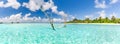 Tropical beach panorama as summer landscape with beach swing or hammock and white sand and calm sea for beach banner Royalty Free Stock Photo
