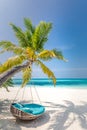 Tropical beach background as summer relax landscape with beach swing or hammock and white sand and calm sea for beach template Royalty Free Stock Photo