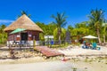 Tropical beach parasols sunbeds Punta Esmeralda Playa del Carmen Mexico