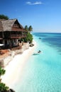 Tropical Beach Resort Paradise with Thatched Roof Villa, White Sand Beach and Turquoise Water Royalty Free Stock Photo