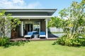 Tropical beach resort. Swimming pool near living room Royalty Free Stock Photo