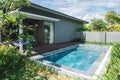 Tropical beach resort. Swimming pool near living room Royalty Free Stock Photo