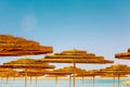 Tropical beach scenery with sun parasols Royalty Free Stock Photo