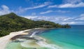 Tropical beach with sea and palm taken from drone. Beach and sea