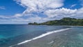 Tropical beach with sea and palm taken from drone. Beach and sea photo. Romantic beach aerial view