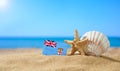 Tropical beach with seashells and Fiji flag. Royalty Free Stock Photo