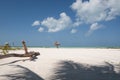 Tropical beach with straw umbrella against sky Royalty Free Stock Photo