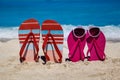 Tropical beach in the summer with flip flops in the sand and sun Royalty Free Stock Photo