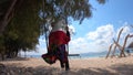 Woman enjoying swing toy, holiday concept