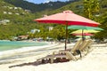 Tropical beach with umbrellas, Cane Garden Bay, Tortola, Caribbean Royalty Free Stock Photo