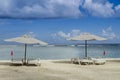 Tropical beach with umbrellas during summer times.