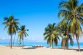 The tropical beach of Varadero in Cuba with sailboats and palm trees on a summer day with turquoise water. Vacation background Royalty Free Stock Photo