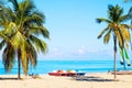 The tropical beach of Varadero in Cuba with sailboats and palm trees on a summer day with turquoise water. Vacation background Royalty Free Stock Photo