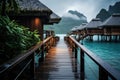 Tropical beach with water bungalows and wooden bridge at sunset, Over water bungalows with steps into green lagoon, AI Generated Royalty Free Stock Photo