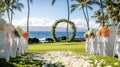 Tropical Beach Wedding Ceremony Setup with Floral Arch and Decorated Chairs Royalty Free Stock Photo