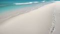 Beach with white sand, turquoise water and footsteps in the sand Royalty Free Stock Photo