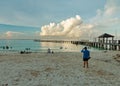 Tropical beach with wooden pier