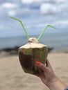 Tropical bliss: embrace the beachside serenity while drinking coconut Royalty Free Stock Photo