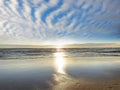 Tropical blue sunset at sea light sun reflection on ocean water white fluffy clouds at sky  beautiful nature landscape Royalty Free Stock Photo