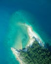 Natural beach with turquoise water and rocks aerial