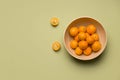 tropical citrus kumquat fruiton a green background. copy space Royalty Free Stock Photo