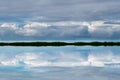 Tropical clouds reflecting in ocean. Royalty Free Stock Photo