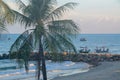 Tropical coastal waterscape with fishing boats departing the harbour with a blue sky over the ocean breakwall. Thailand Royalty Free Stock Photo