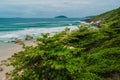 Tropical coastline with beach, trees and clear ocean with waves in Brasil. Aerial drone view Royalty Free Stock Photo