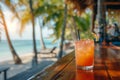 Tropical cocktail on a beach cafe table. Refreshing fruit cocktail on luxury tropical beach resort. Party, summer vacations,