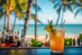 Tropical cocktail on a beach cafe table. Refreshing fruit cocktail on luxury tropical beach resort. Party, summer vacations,