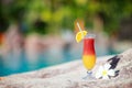 Tropical cocktail and frangipani flower