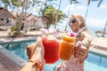 Tropical cocktails cheers woman. Healthy drink. Celebration and tropical party Royalty Free Stock Photo