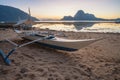 Tropical colorful sunset with a local banca boat in El Nido, Palawan - Philippines Royalty Free Stock Photo
