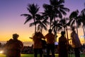 Tropical colorful sunset with Orchestra and palm trees silhouette in Waikiki beach Royalty Free Stock Photo