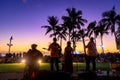 Tropical colorful sunset with Orchestra and palm trees silhouette in Waikiki beach Royalty Free Stock Photo