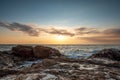 Tropical colorful sunset at the stones beach Royalty Free Stock Photo